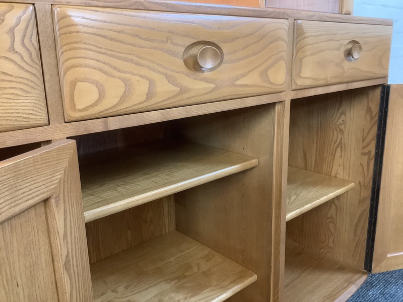 Ercol Windsor High Display Cabinet In Light Finish.