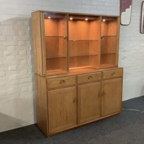 Ercol Windsor High Display Cabinet In Light Finish.
