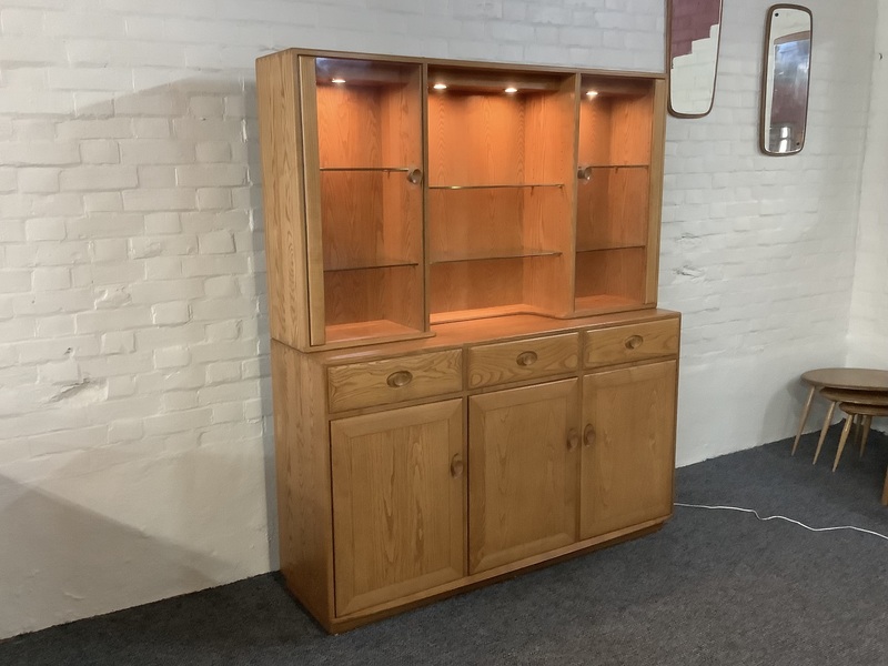 Ercol Windsor High Display Cabinet In Light Finish.