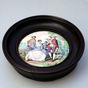 An antique framed English Prattware pottery Pot Lid The Flute Player C.19thC