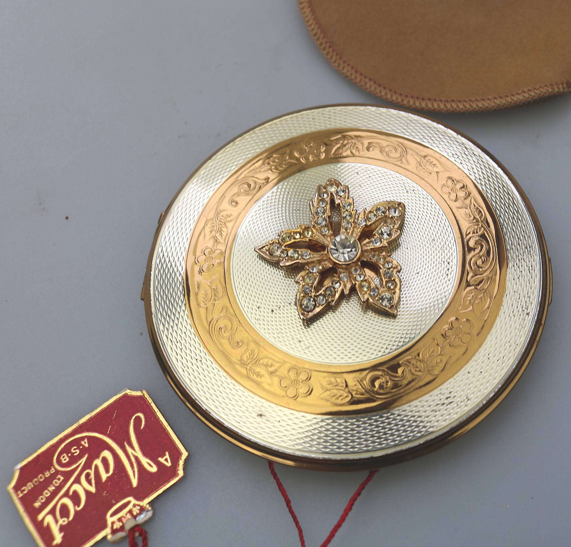 A very fine mid-century AS Brown Mascot diamante Compact unused & label C.1950's