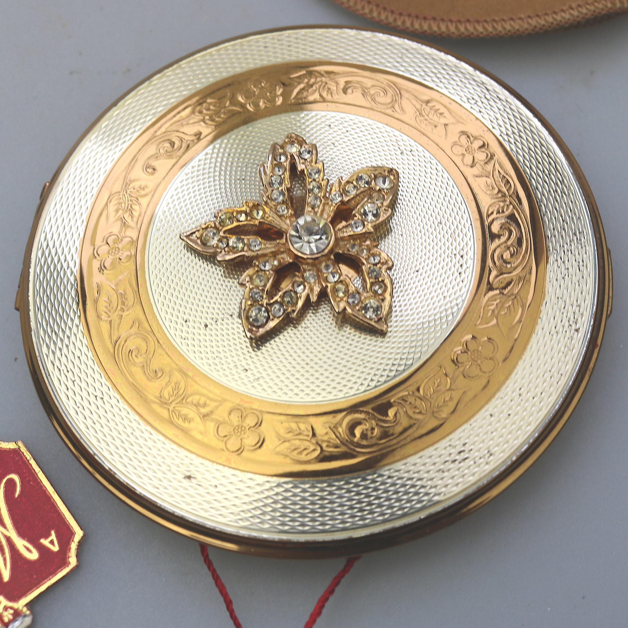 A very fine mid-century AS Brown Mascot diamante Compact unused & label C.1950's