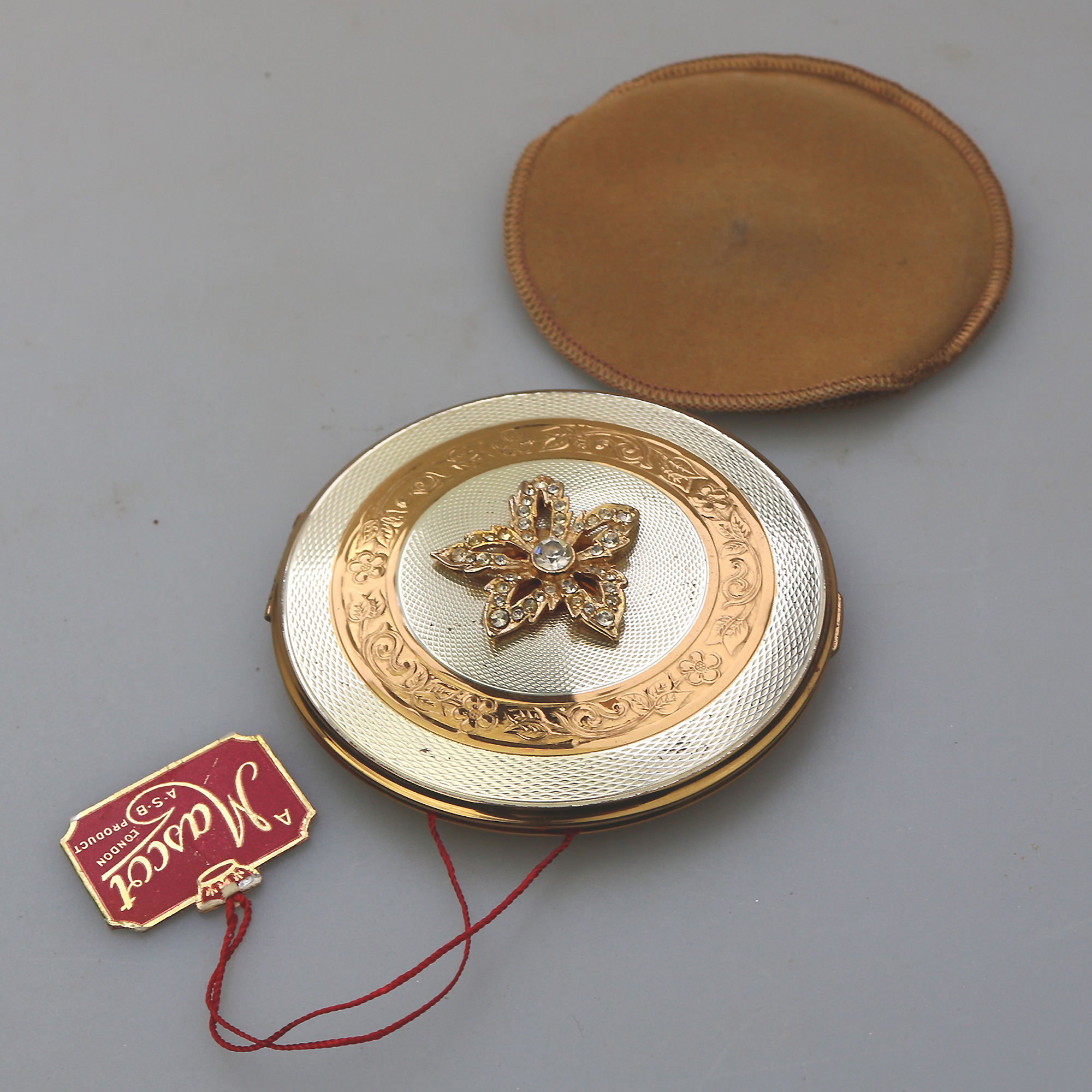 A very fine mid-century AS Brown Mascot diamante Compact unused & label C.1950's