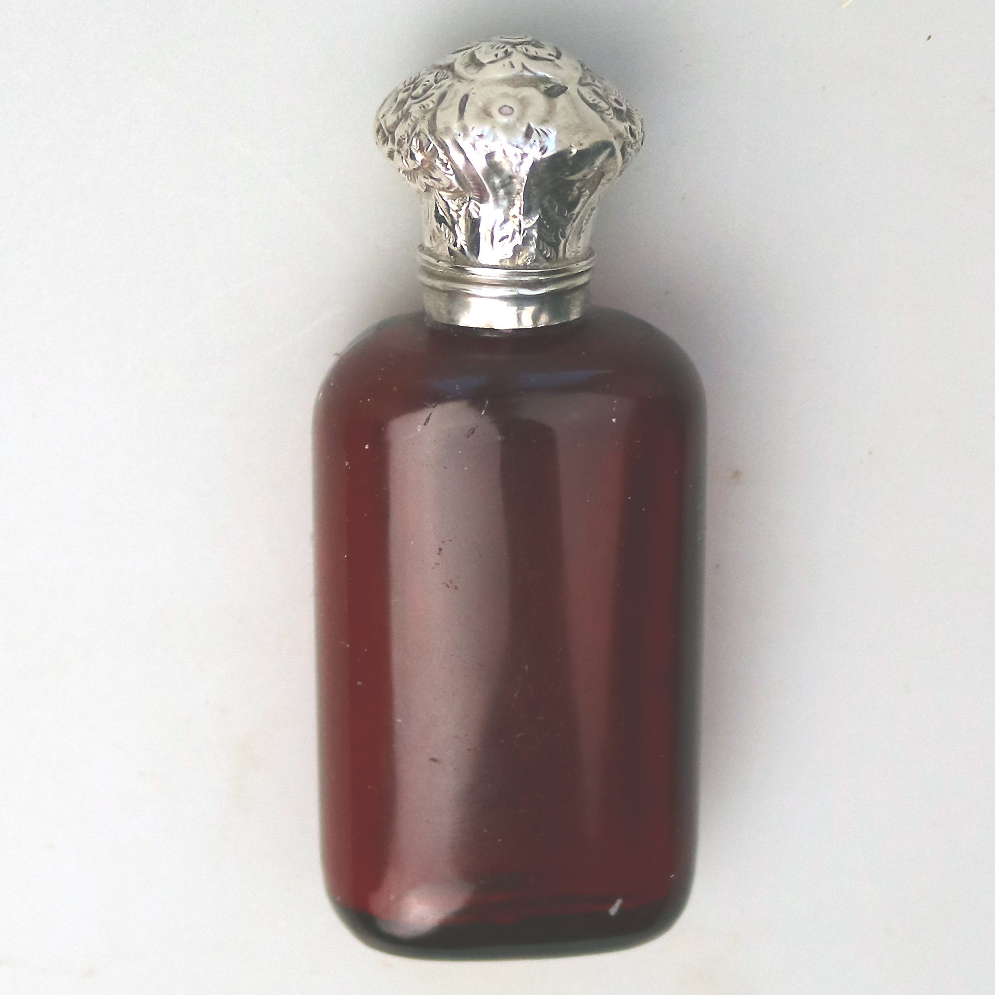 A good antique solid silver and ruby glass Scent Bottle C.19thC