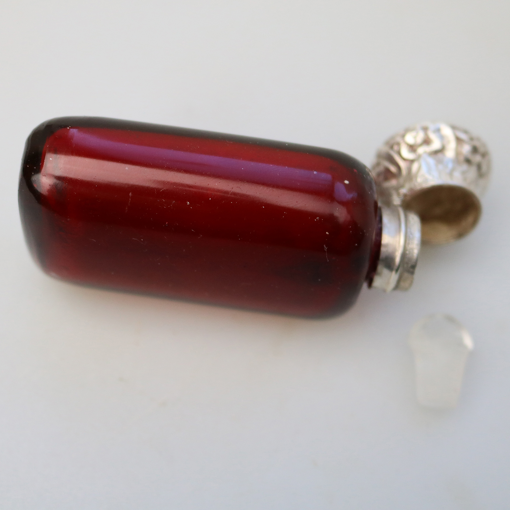 A good antique solid silver and ruby glass Scent Bottle C.19thC