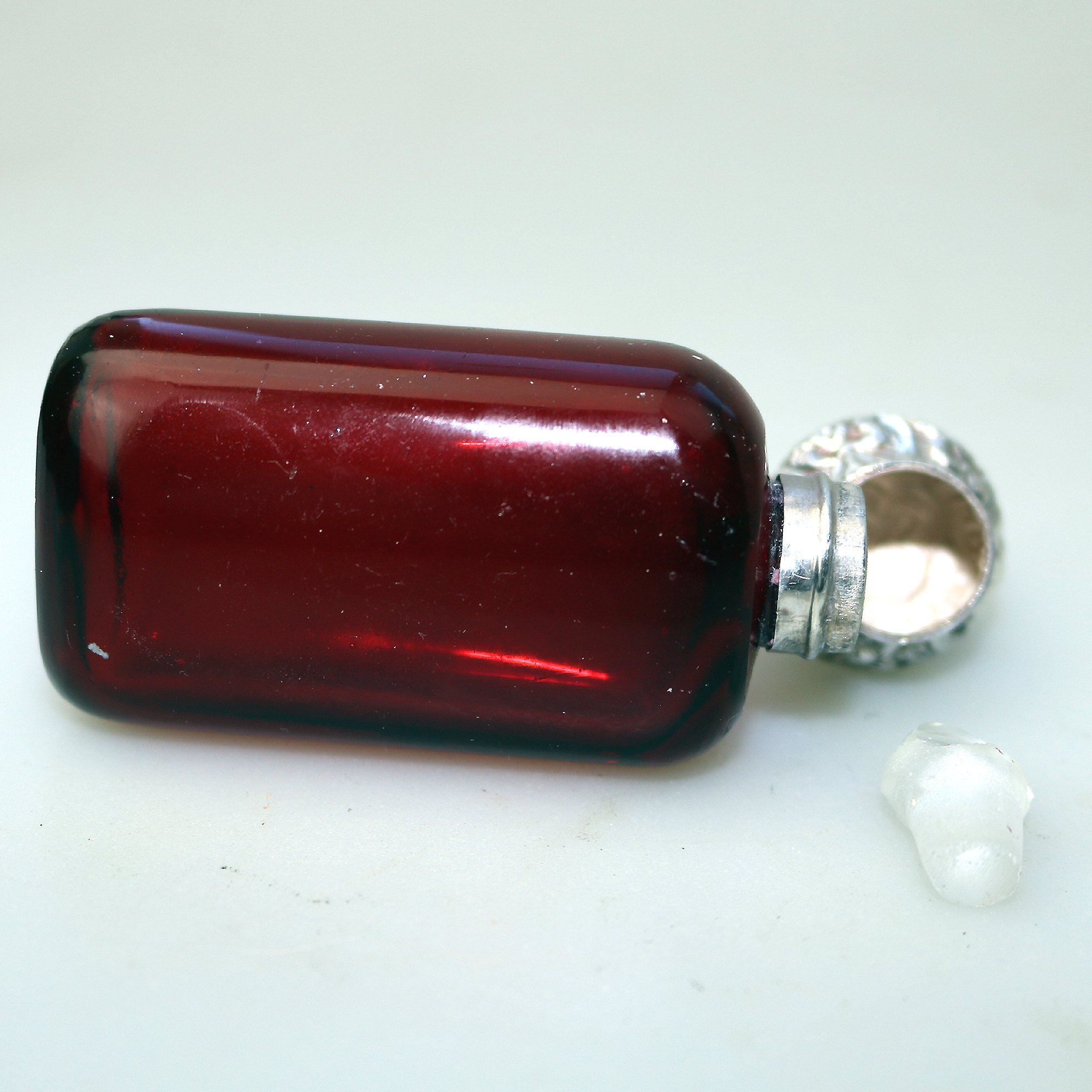 A good antique solid silver and ruby glass Scent Bottle C.19thC