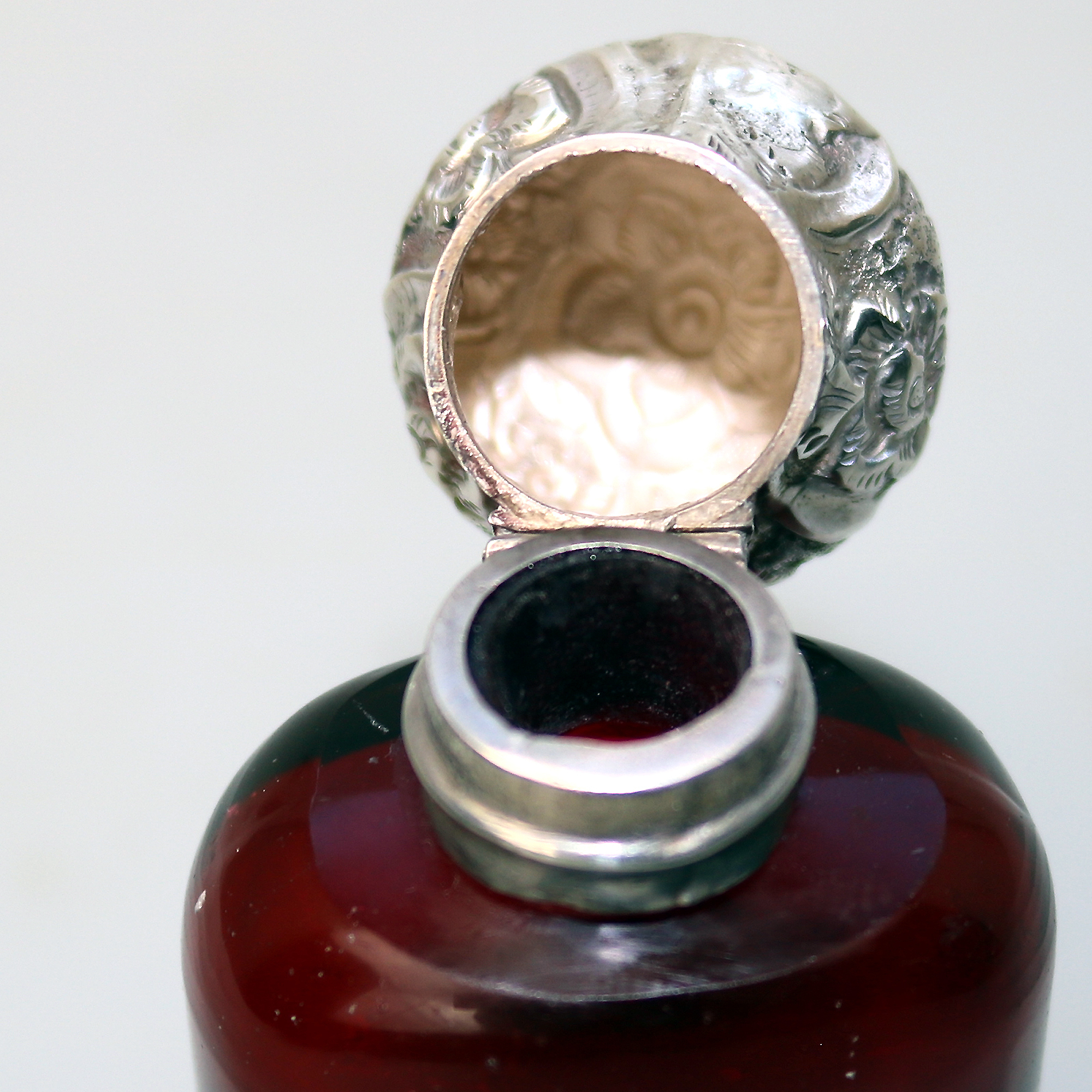 A good antique solid silver and ruby glass Scent Bottle C.19thC