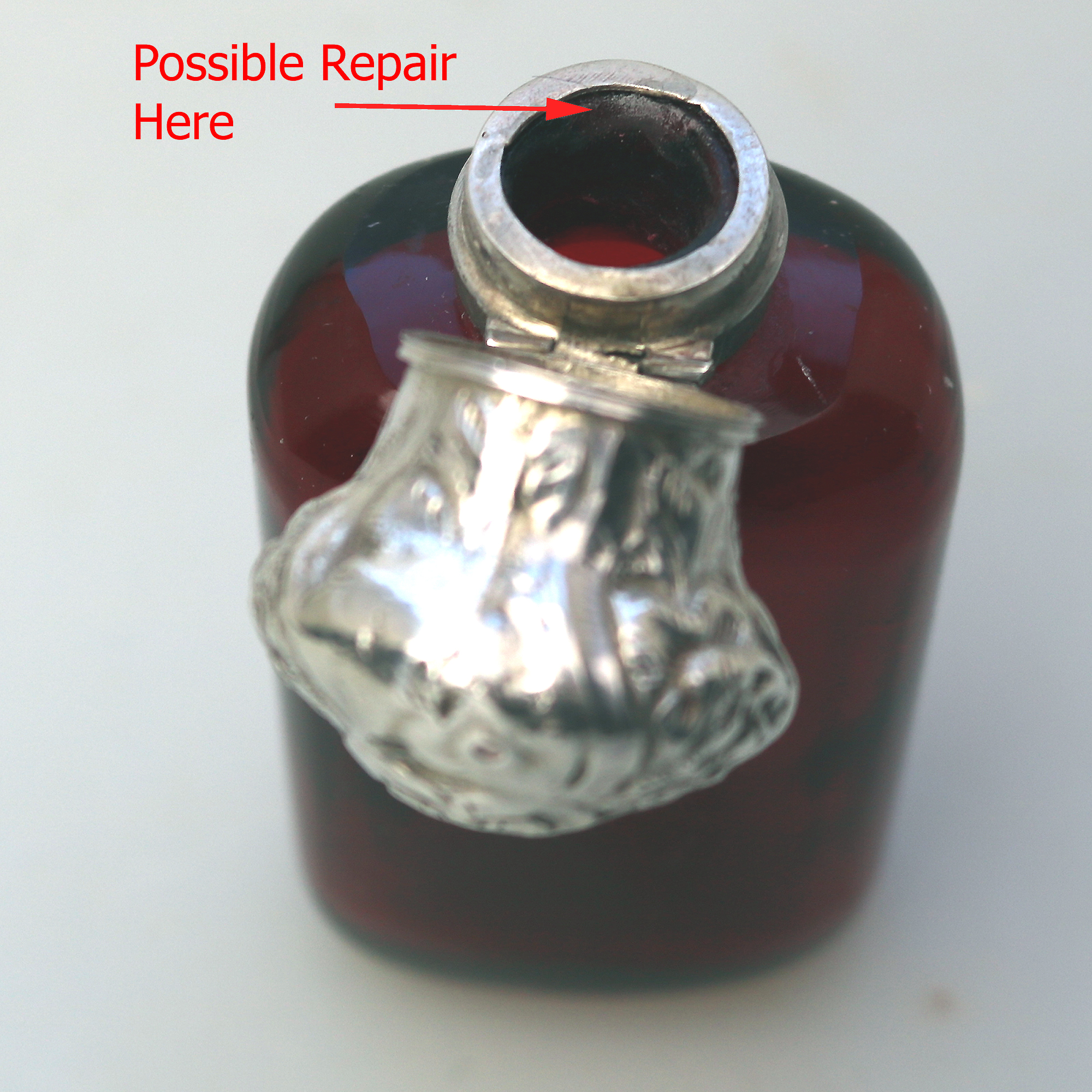 A good antique solid silver and ruby glass Scent Bottle C.19thC