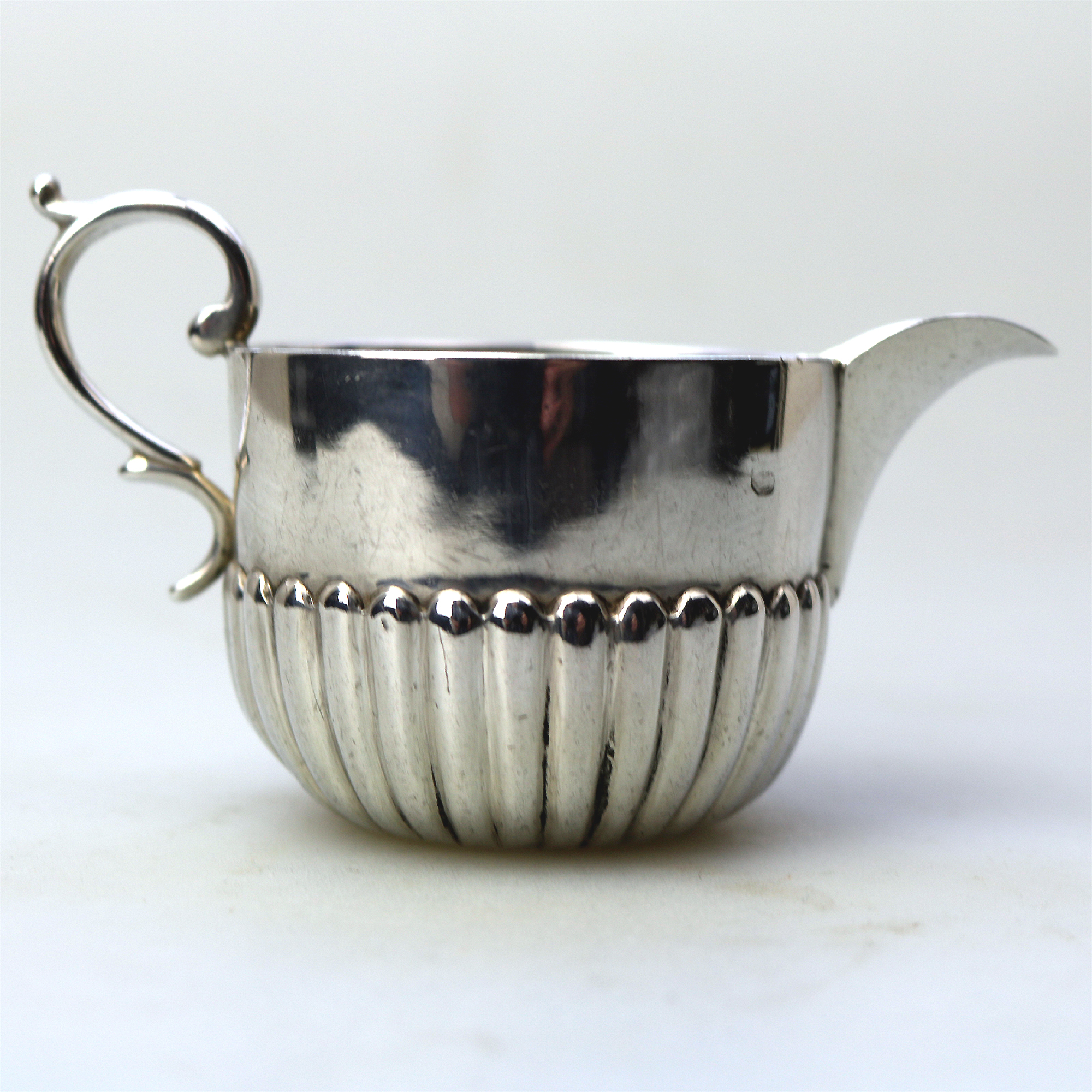 A small antique Victorian English sterling solid silver Cream Jug for one C.1886