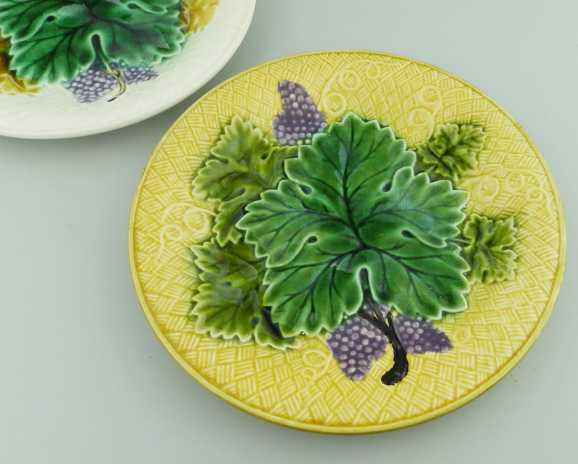 A pretty pair 2X antique Victorian majolica pottery grape & leaf Plates C.19thC
