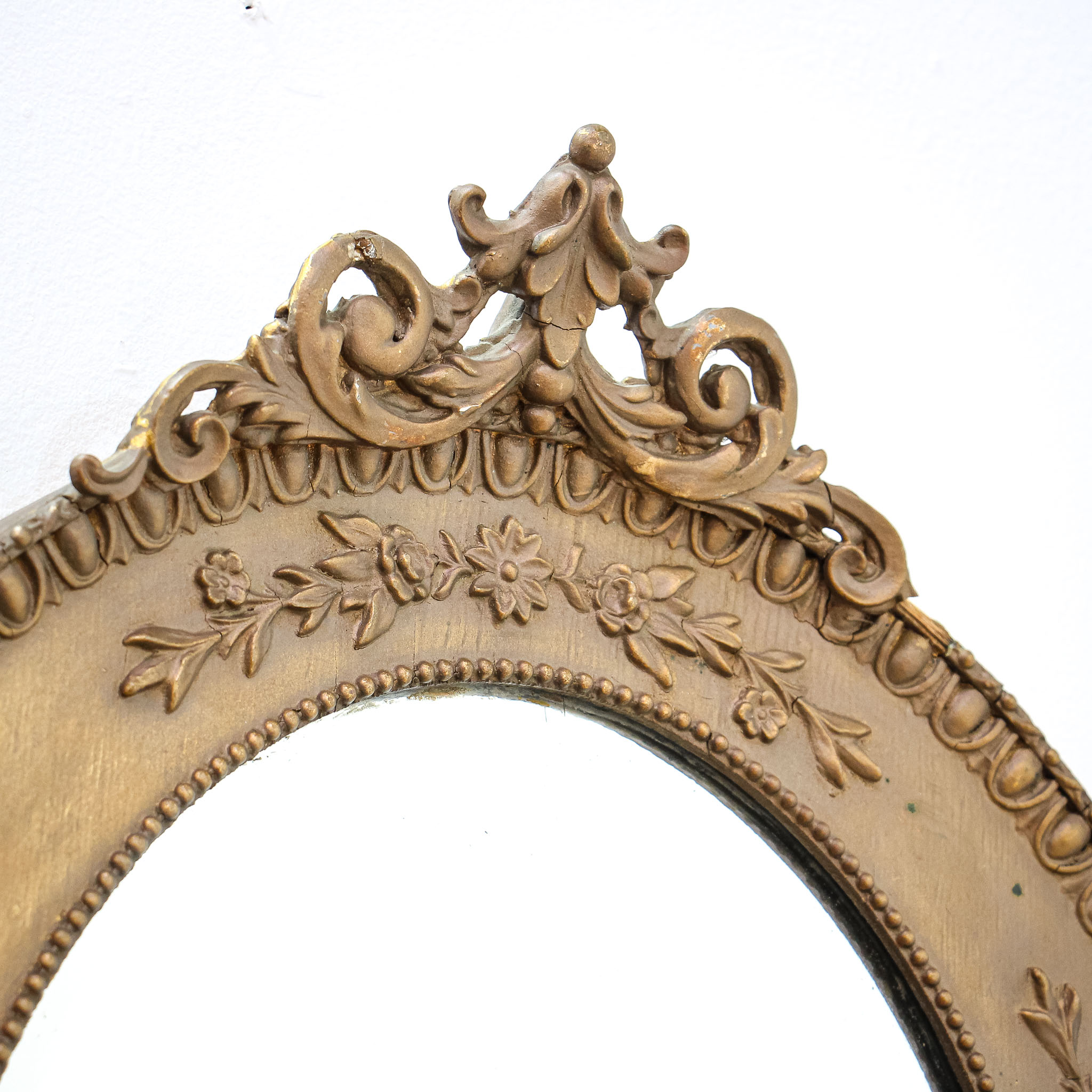 Pair of Oval Mirrors in Bronzed Ornate Wood Frames