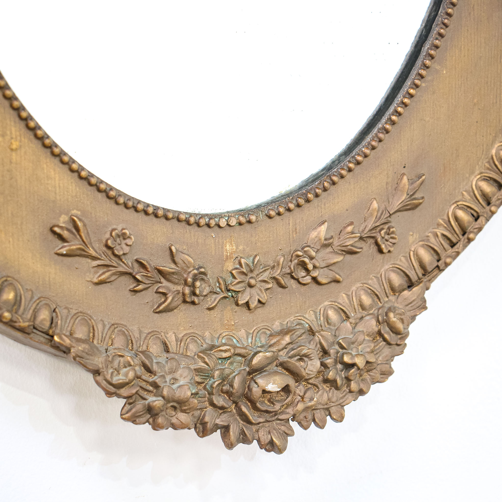 Pair of Oval Mirrors in Bronzed Ornate Wood Frames