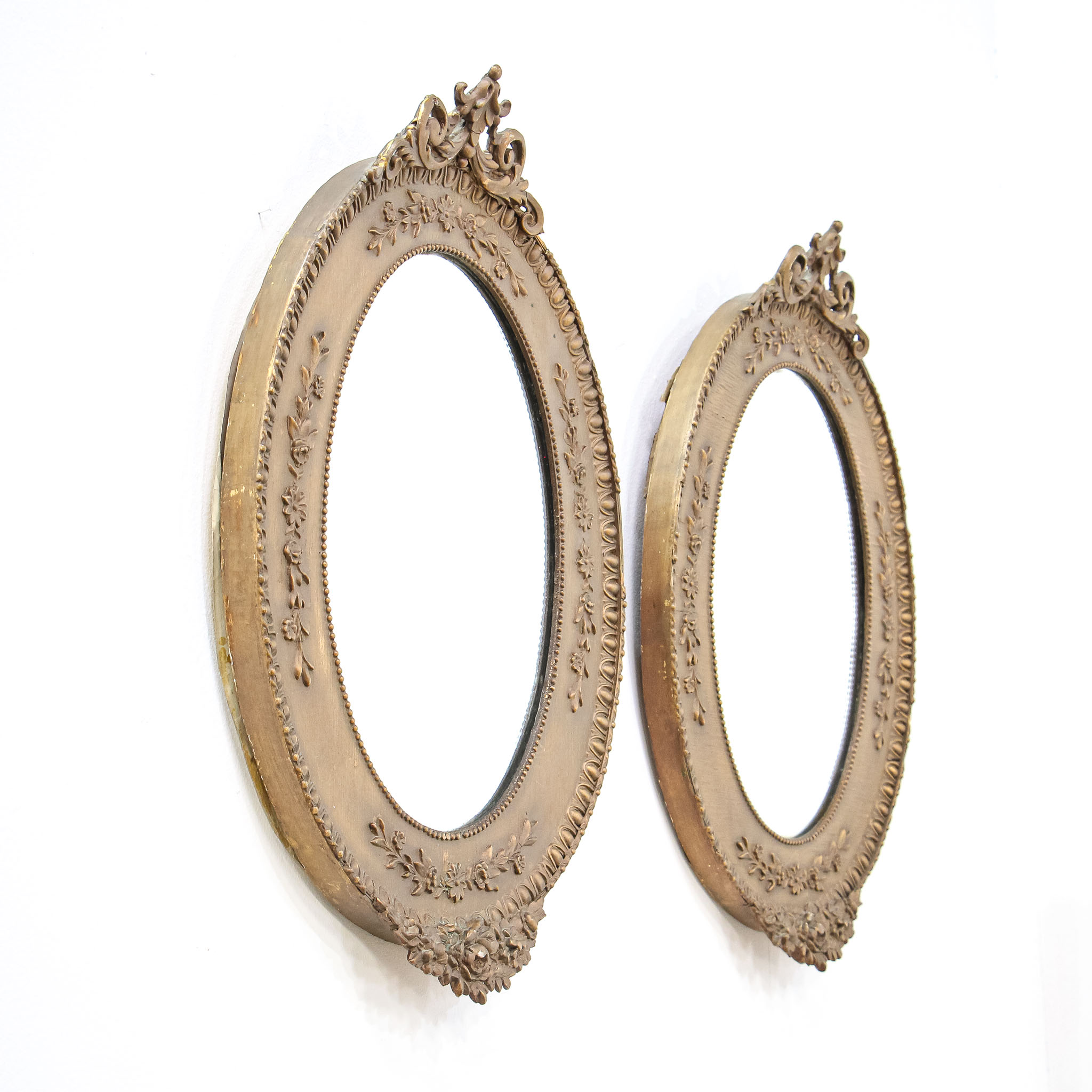Pair of Oval Mirrors in Bronzed Ornate Wood Frames