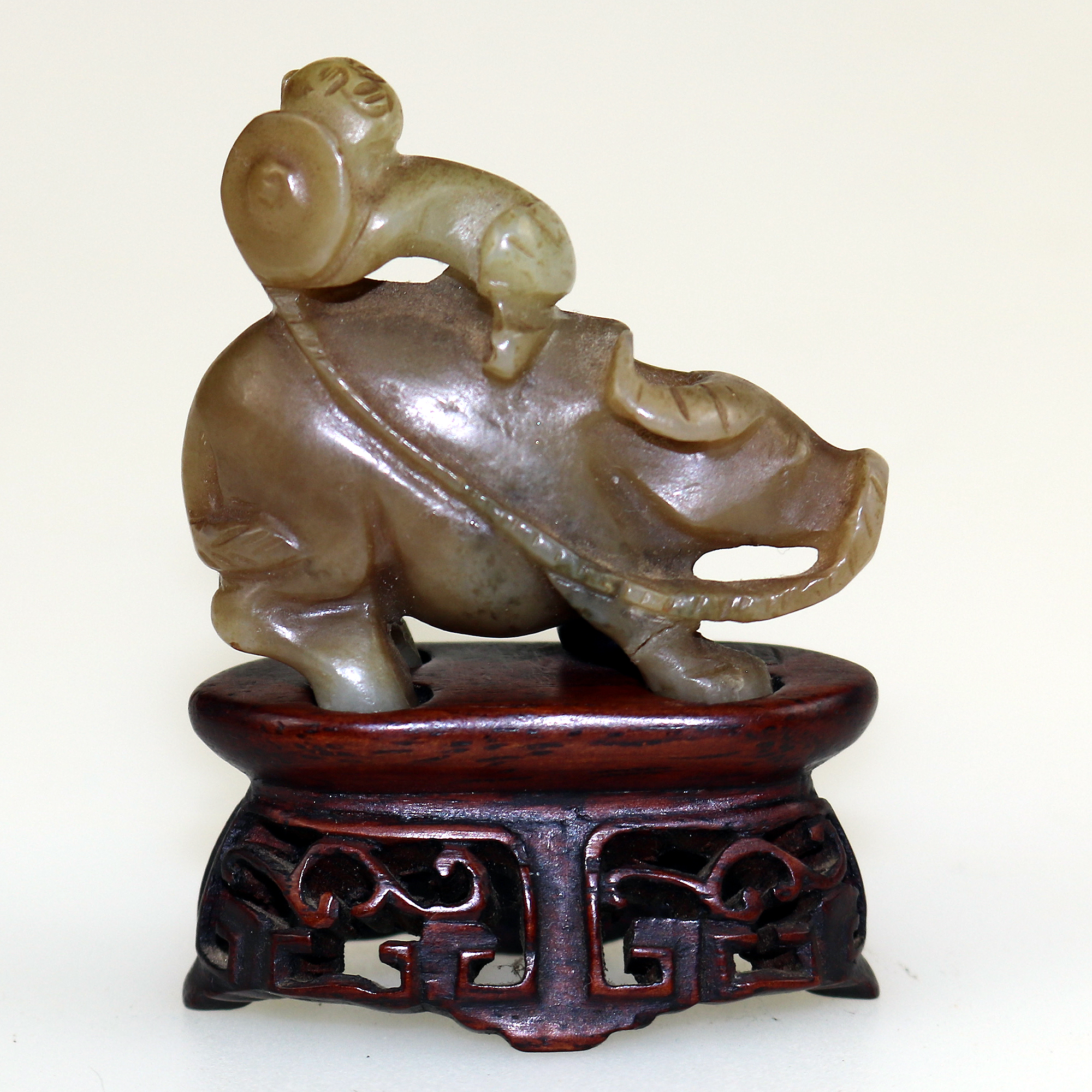 An antique miniature hand carved hardstone nephrite Figure on stand C.19th/20thC