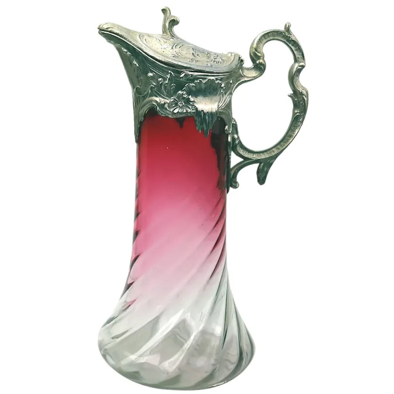 A substantial antique Art Nouveau cranberry glass wrythen Claret Jug C. pre 1900