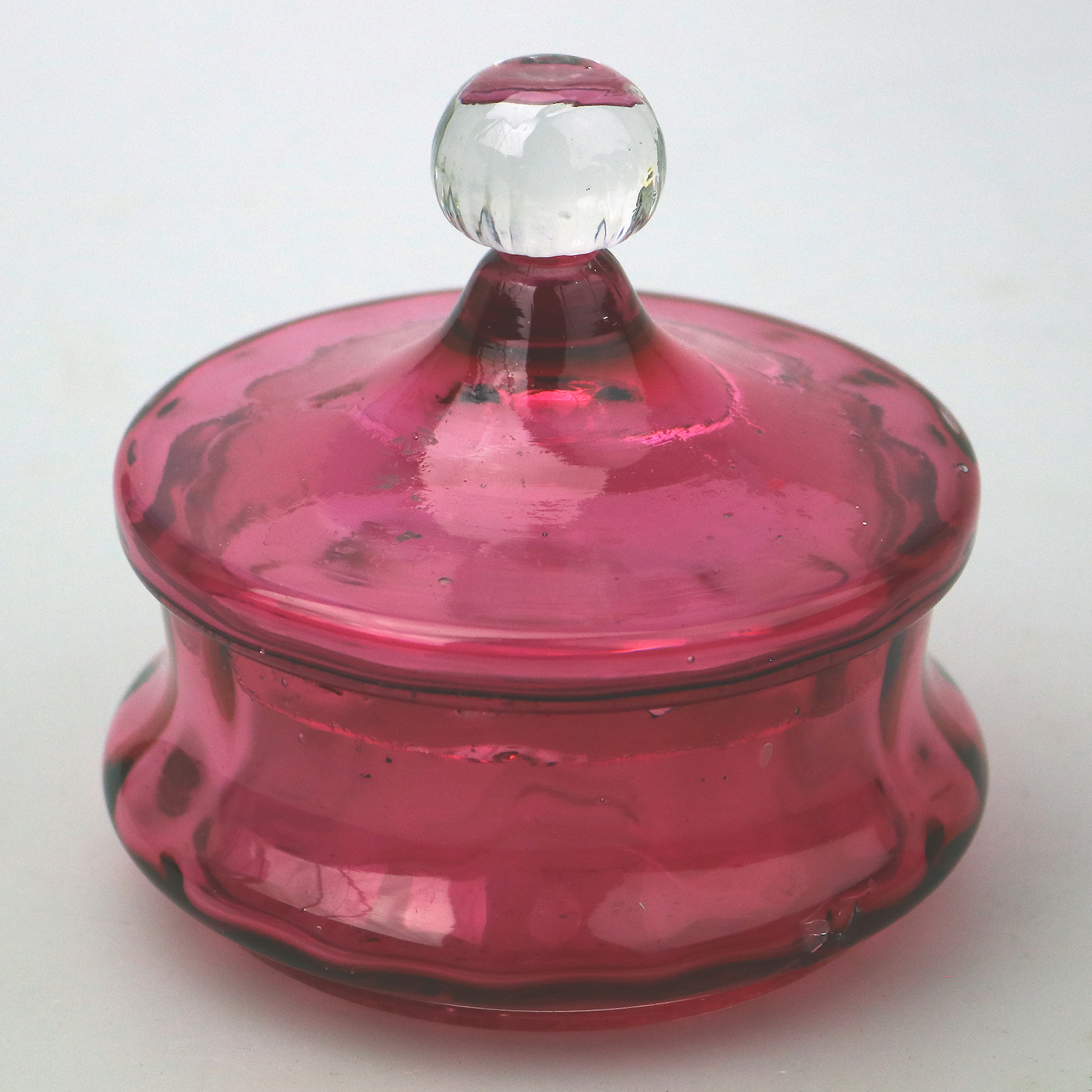 A pretty antique Victorian cranberry art glass lidded Bowl 11cm dia C.19thC