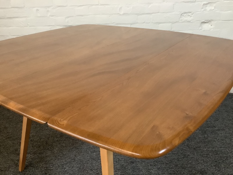 Ercol Windsor 492 Drop Leaf Dining Table In Natural Elm Finish.