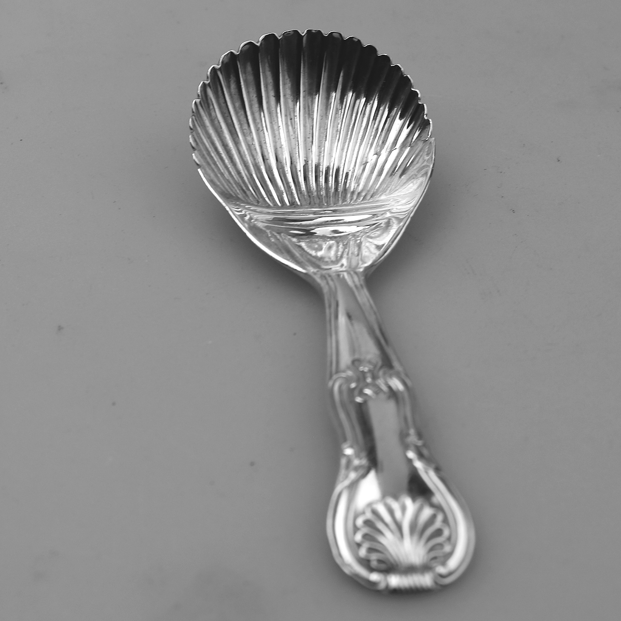 An antique Georgian Irish solid silver Kings handle Caddy Spoon Dublin C.1822