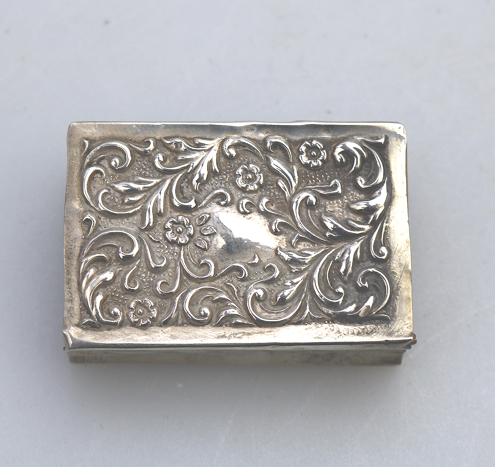 An antique Art Nouveau English solid silver repousse Matchbox Cover C.1904