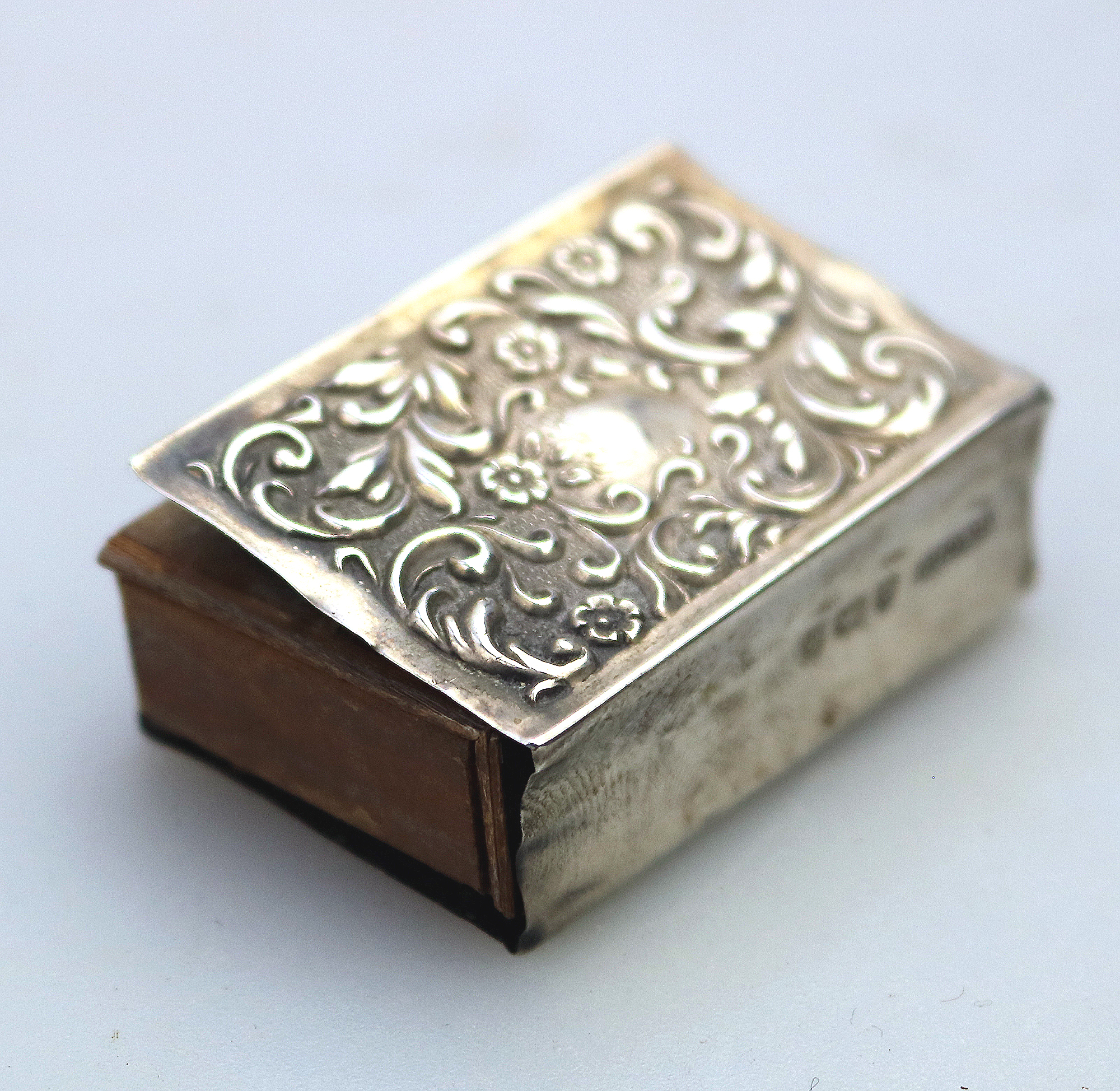 An antique Art Nouveau English solid silver repousse Matchbox Cover C.1904