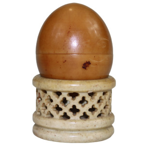 An unusual antique oriental threaded carved nut box on hardstone stand C.1900