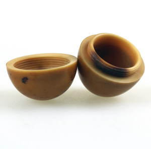 An unusual antique oriental threaded carved nut box on hardstone stand C.1900