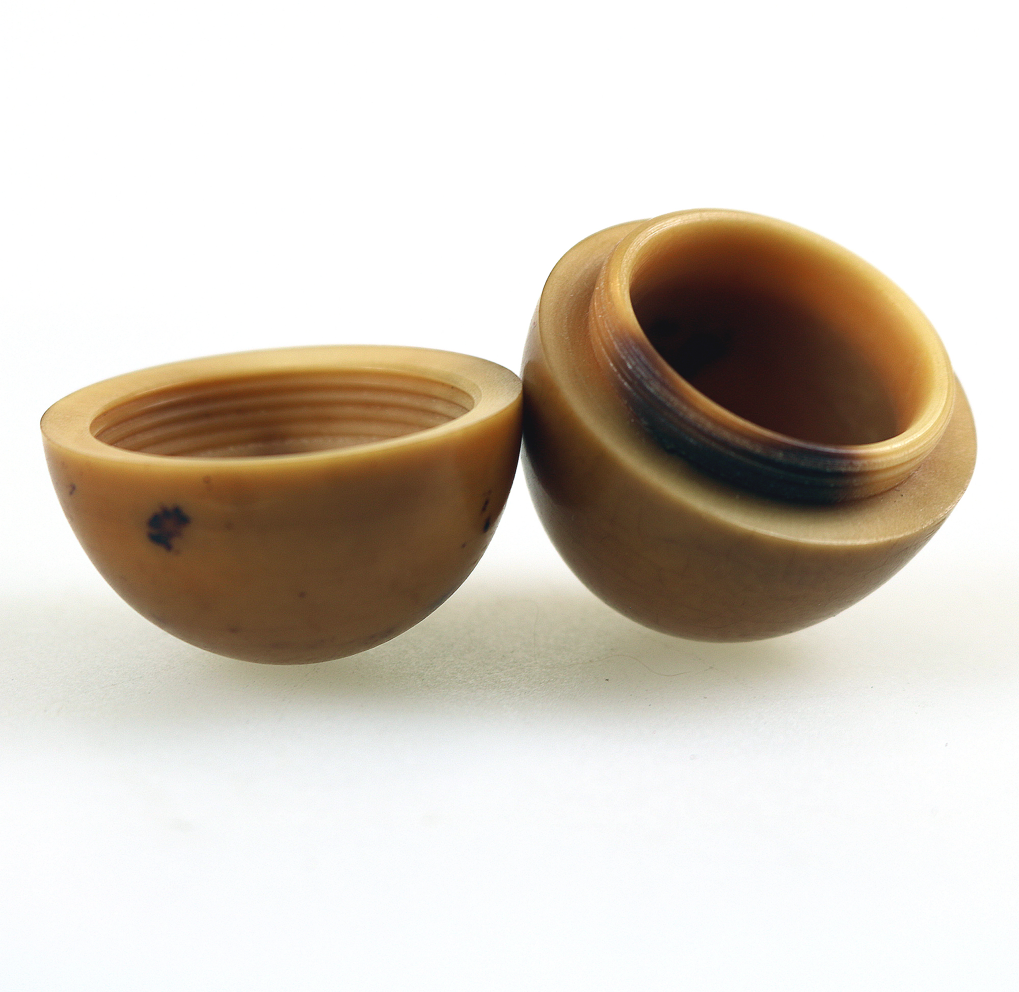 An unusual antique oriental threaded carved nut box on hardstone stand C.1900