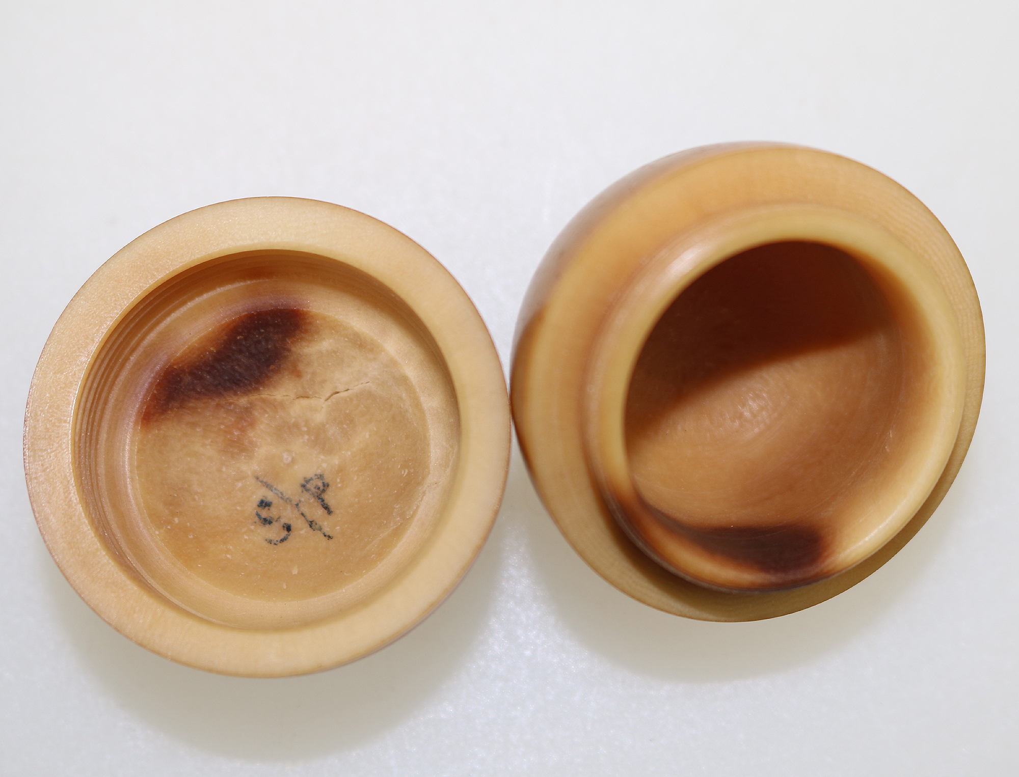 An unusual antique oriental threaded carved nut box on hardstone stand C.1900