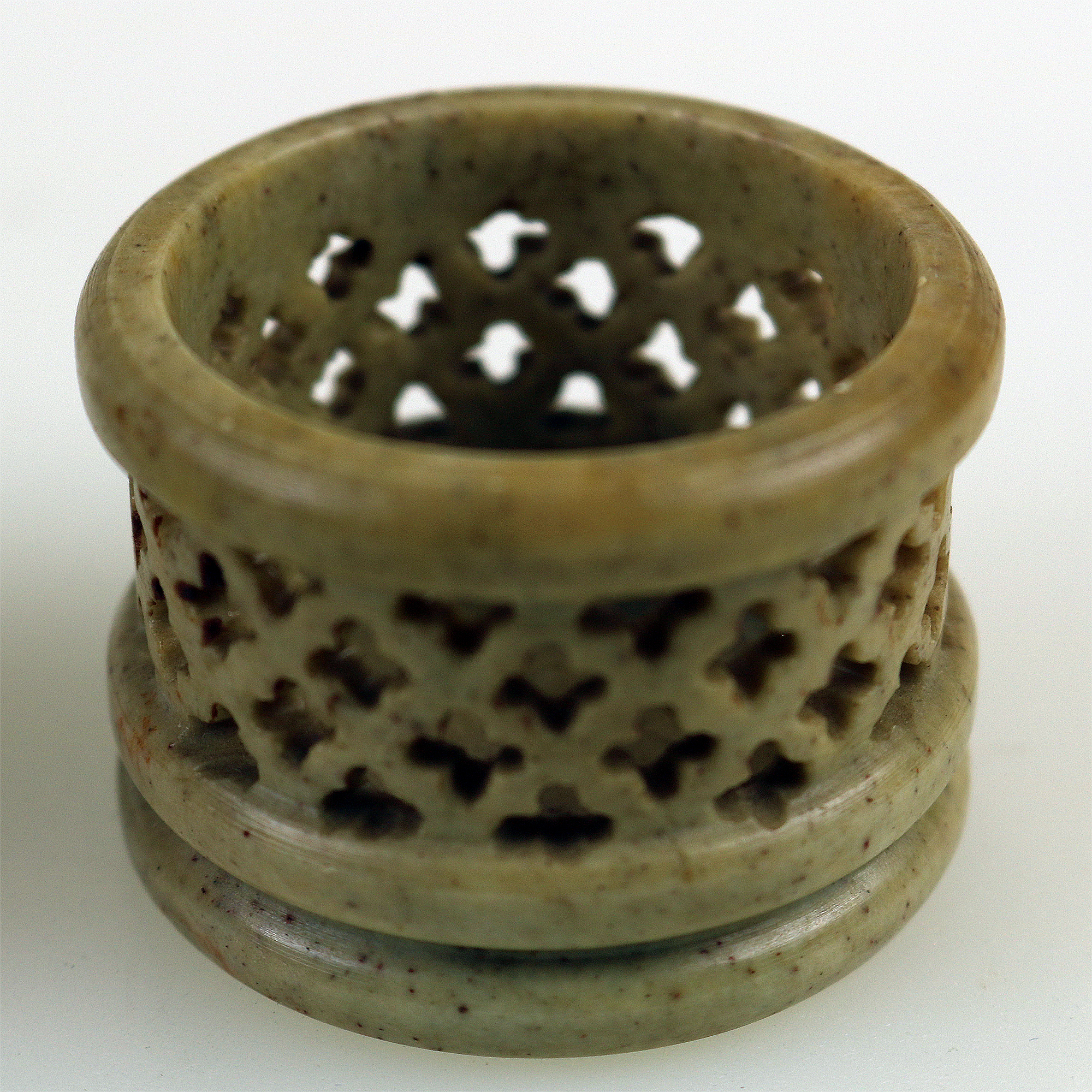 An unusual antique oriental threaded carved nut box on hardstone stand C.1900