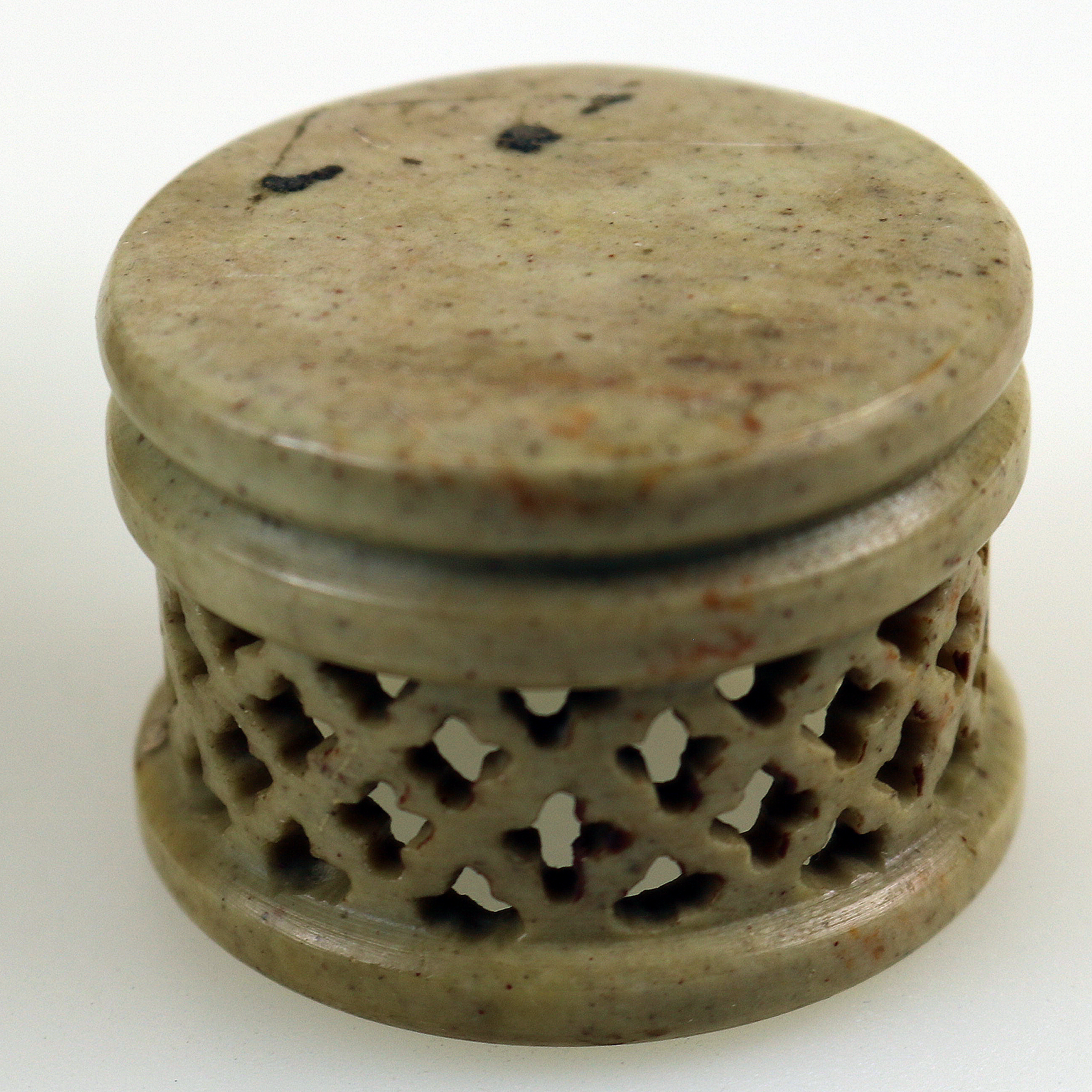 An unusual antique oriental threaded carved nut box on hardstone stand C.1900