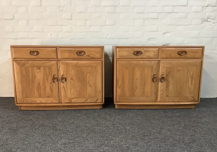 Pair Of Ercol Windsor Sideboard Cabinets In Light Finish.