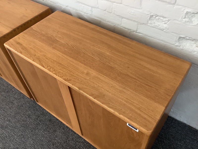 Pair Of Ercol Windsor Sideboard Cabinets In Light Finish.