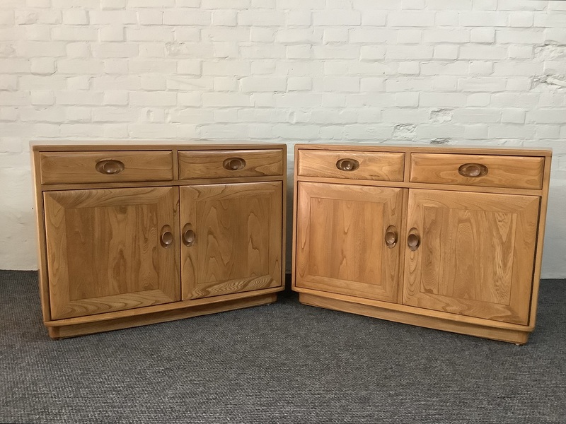 Pair Of Ercol Windsor Sideboard Cabinets In Light Finish.