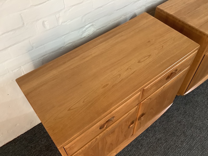 Pair Of Ercol Windsor Sideboard Cabinets In Light Finish.