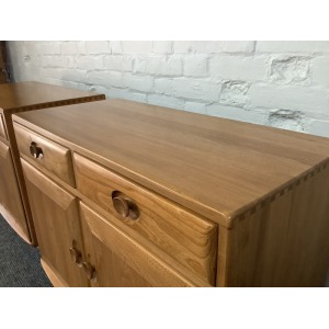 Pair Of Ercol Windsor Sideboard Cabinets In Light Finish.