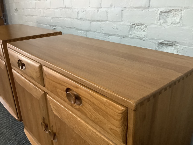Pair Of Ercol Windsor Sideboard Cabinets In Light Finish.