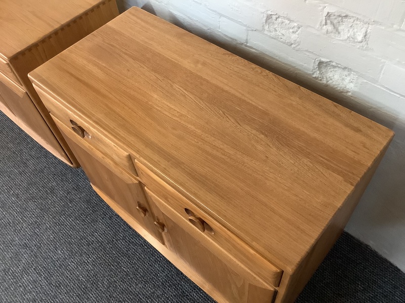 Pair Of Ercol Windsor Sideboard Cabinets In Light Finish.
