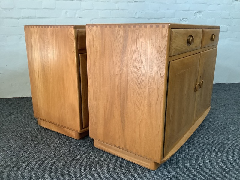 Pair Of Ercol Windsor Sideboard Cabinets In Light Finish.