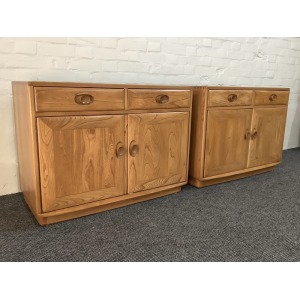 Pair Of Ercol Windsor Sideboard Cabinets In Light Finish.