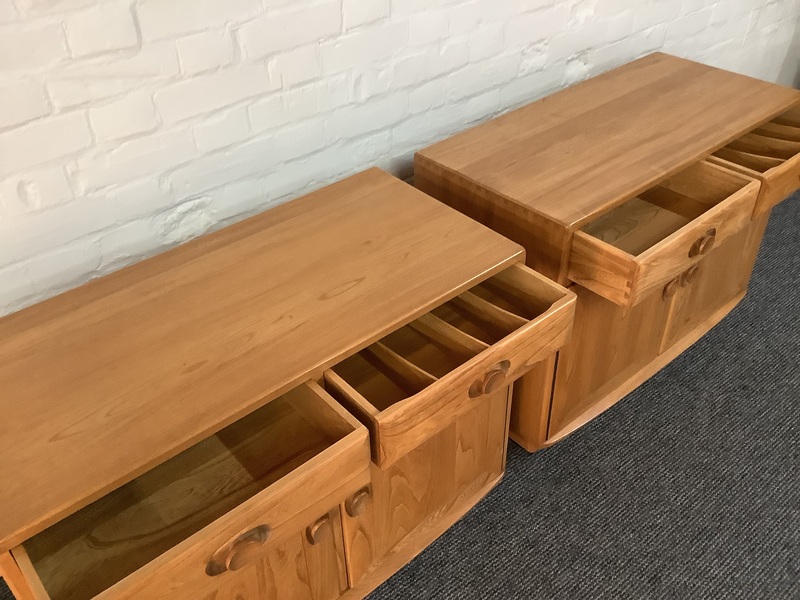 Pair Of Ercol Windsor Sideboard Cabinets In Light Finish.