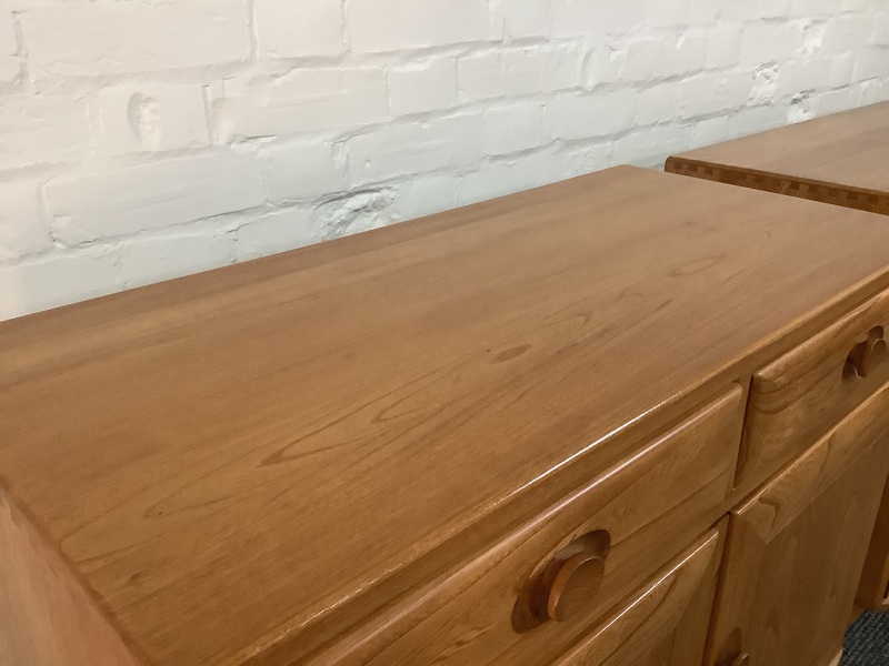Pair Of Ercol Windsor Sideboard Cabinets In Light Finish.