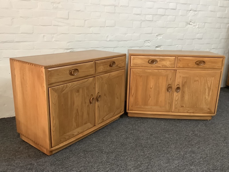 Pair Of Ercol Windsor Sideboard Cabinets In Light Finish.