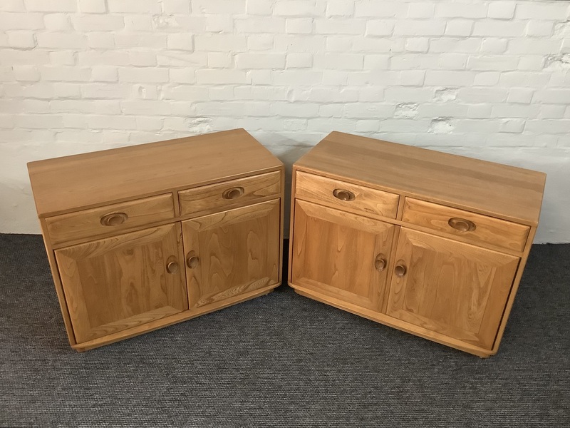 Pair Of Ercol Windsor Sideboard Cabinets In Light Finish.