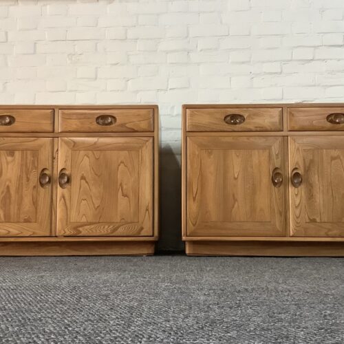 Pair Of Ercol Windsor Sideboard Cabinets In Light Finish.