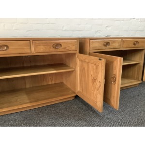 Pair Of Ercol Windsor Sideboard Cabinets In Light Finish.