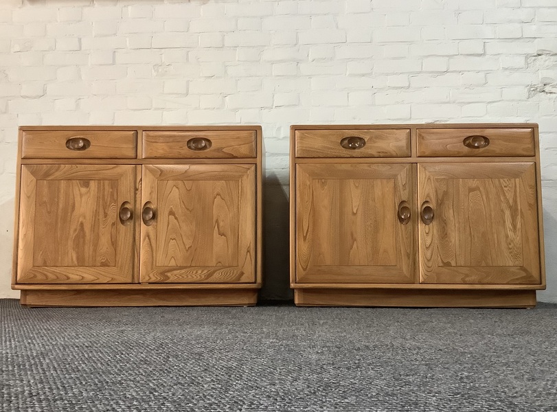 Pair Of Ercol Windsor Sideboard Cabinets In Light Finish.