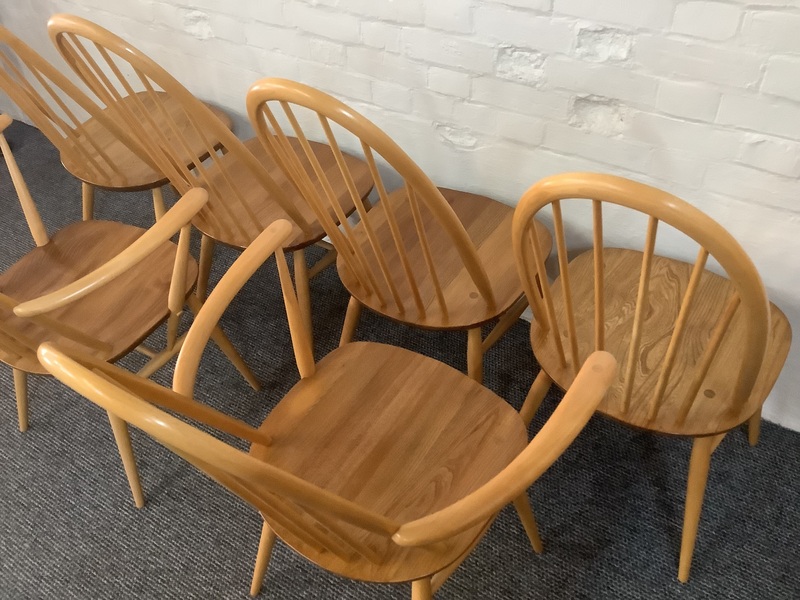 Set Of Six Ercol Windsor Quaker Back Dining Chairs In Light Finish.