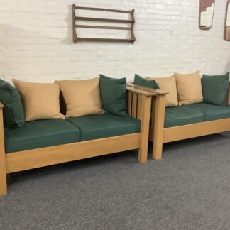 A Substantial Pair Of 3 Seater Settees In Solid English Light Oak.