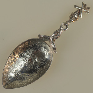 A 925 solid silver Caddy Spoon with twin dolphin and windmill stem C.early 20thC