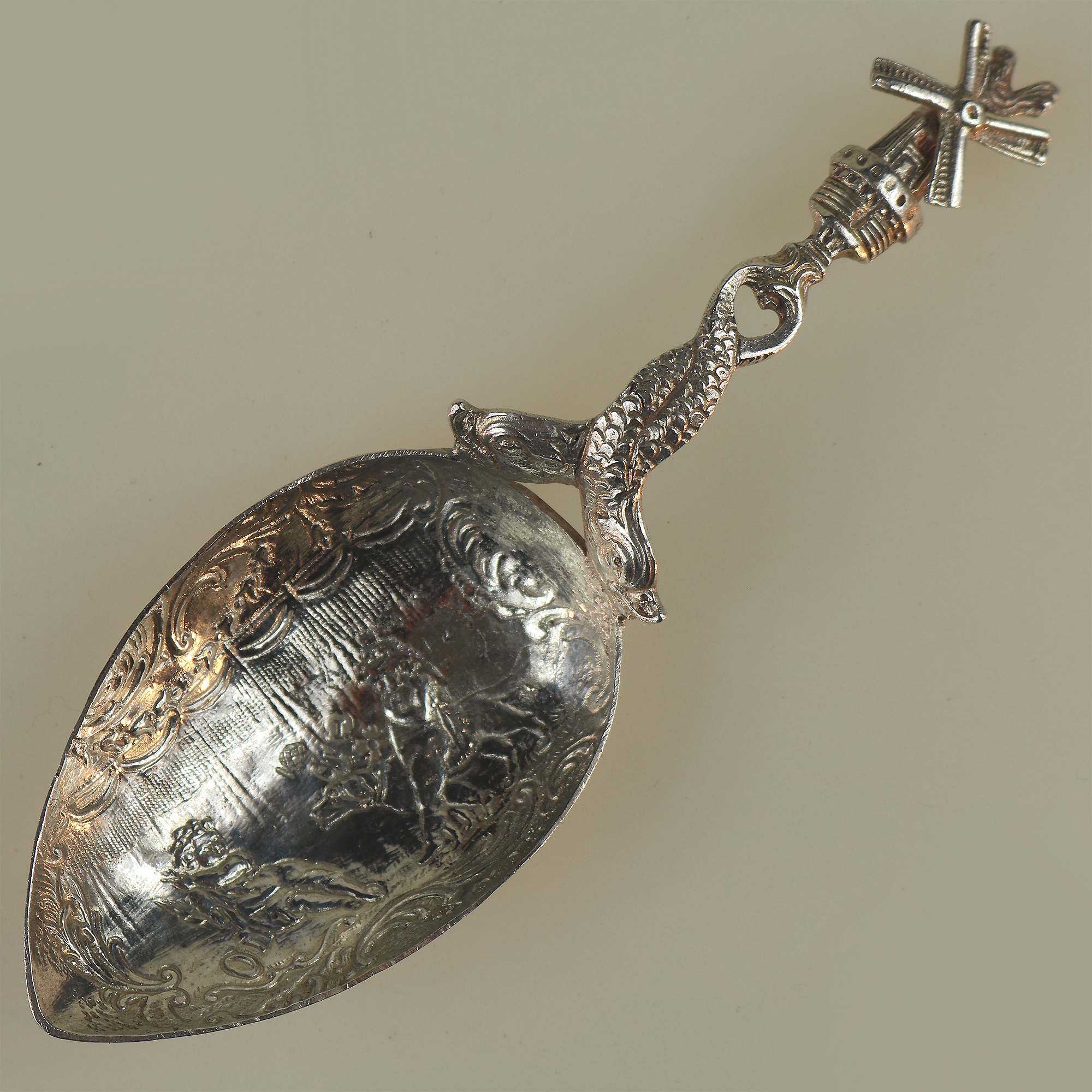A 925 solid silver Caddy Spoon with twin dolphin and windmill stem C.early 20thC